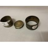 TWO HALLMARKED SILVER NAPKIN RINGS AND A HALLMARKED SILVER PILL BOX