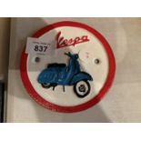 A SMALL VINTAGE STYLE CIRCULAR CAST VESPA SCOOTER SIGN
