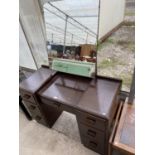 A MAHOGANY DRESSING TABLE WITH SEVEN DRAWERS AND UPPER UNFRAMED MIRROR