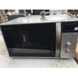 A SHARP CONVECTION, GRILL, MICROWAVE OVEN IN WORKING ORDER