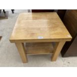 A SQUARE BEECH COFFEE TABLE WITH LOWER SHELF