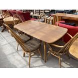 AN ERCOL WINDSOR DINING TABLE WITH FOUR DINING CHAIRS AND TWO CARVERS
