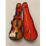 A CASED MINIATURE VIOLIN