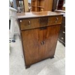 A WALNUT TALLBOY WITH TWO DOORS AND ONE DRAWER