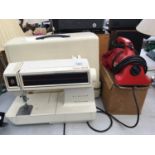 A SINGER FUTURA 2001 SEWING MACHINE TOGETHER WITH A DIRT DEVIL HAND HELD CLEANER, IN WORKING ORDER