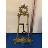 AN ORNATE BRASS EASEL