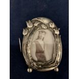 AN ART DECO STYLE SILVER MINATURE PHOTOGRAPH FRAME