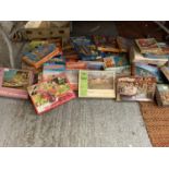 A LARGE COLLECTION OF VINTAGE JIGSAWS, GAMES ETC