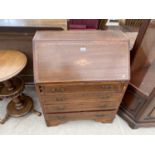 AN INLAID MAHOGANY BUREAU WITH FALL FRONT AND FOUR DRAWERS