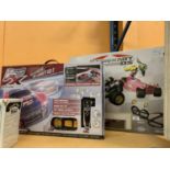 A REAL FX SLOTLESS RACING CAR SET AND A MARIOCART SLOT RACING SYSTEM GAME