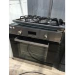 A CANDY GAS HOB WITH A BUILT IN ELECTRIC OVEN, GRILL NOT WORKING, NO PLUG SO UNABLE TO TEST