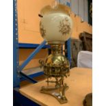 A VINTAGE BRASS OIL LAMP WITH GLASS SHADE AND FUNNEL