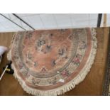 A CIRCULAR BROWN PATTERNED RUG