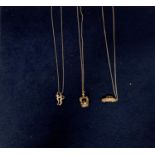THREE SILVER NECKLACES TO INCLUDE A CAR, CROWN AND CAT