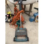 A LAWN RAKER, STRIMMERS ETC