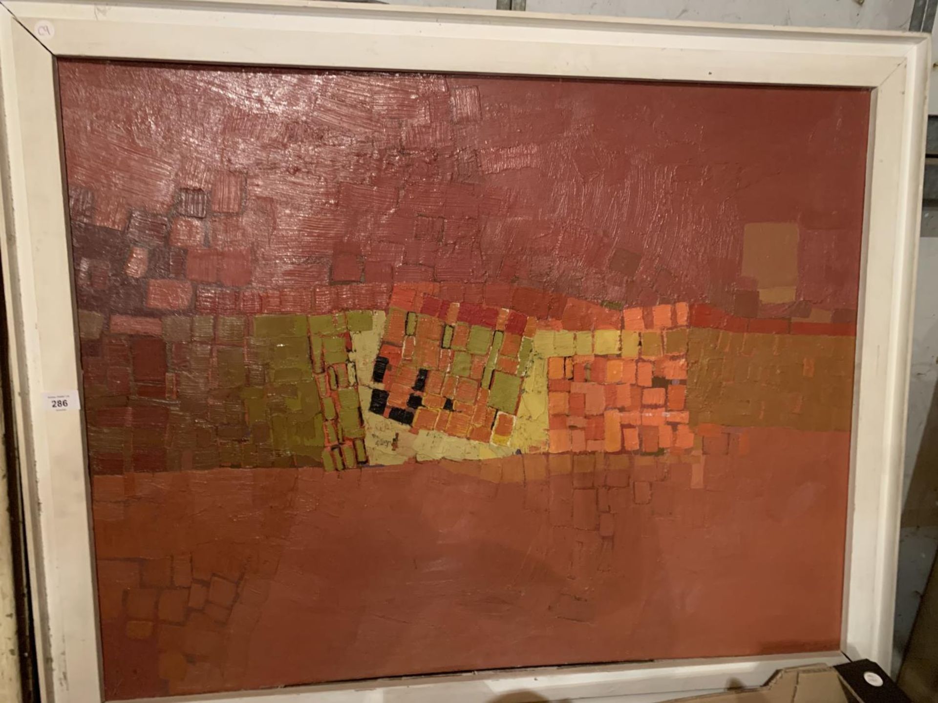 A LARGE FRAMED ABSTRACT PAINTING