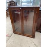 A WALL MOUNTED MAHOGANY CABINET WITH TWO GLAZED DOORS
