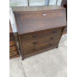 AN OAK BUREAU WITH FALL FRONT, TWO LONG AND TWO SHORT DRAWERS