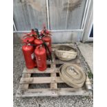 TWO LARGE FIRE HOSES AND SEVEN FIRE EXTINGUISHERS