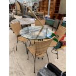 A CIRCULAR GLASS TOPPED GARDEN TABLE WITH FOUR CHAIRS