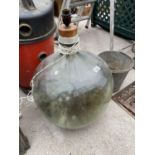 A VINTAGE GLASS CARBOY LAMP