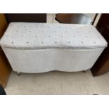 A LLOYD LOOM STYLE OTTOMAN