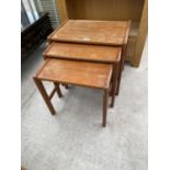 A RETRO TEAK NEST OF THREE TABLES