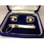 A CUFF LINKS AND TIE PIN SET MARKED SILVER