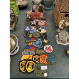 A COLLECTION OF VARIOUS FABRIC BADGES TO INCLUDE MILITARY EXAMPLES
