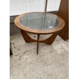 A BELIEVED G PLAN TEAK CIRCULAR COFFEE TABLE WITH GLASS TOP