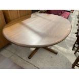 AN ERCOL ELM DINING TABLE