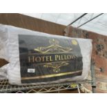 TWO PACKS OF HOTEL PILLOWS (TWO PILLOWS PER PACK)