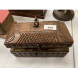 A CARVED WOODEN BOX