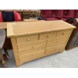 A RUBBERWOOD CHEST OF THREE SHORT AND FOUR LONG DRAWERS