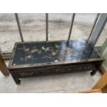 A JAPANNED COFFEE TABLE WITH ORIENTAL DESIGN AND THREE DRAWERS