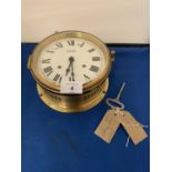 A BRASS GERMAN STOCKBURGER MARITIME CLOCK WITH KEY