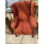 A WING BACK ARMCHAIR