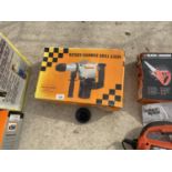 AN ELECTRIC ROTARY HAMMER DRILL, IN WORKING ORDER
