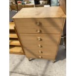 A TEAK CHEST OF SIX DRAWERS