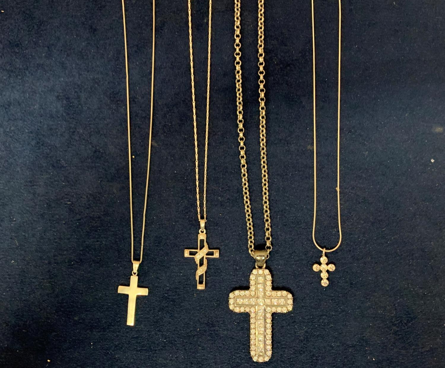 FOUR SILVER CROSS NECKLACES