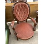A MAHOGANY BUTTON BACK NURSING CHAIR ON CASTERS