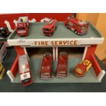 A WOODEN FIRE SERVICE STATION WITH SEVEN VARIOUS FIRE ENGINES