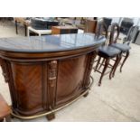 A MAHOGANY BAR WITH BRASS FOOT RAIL, CARVED DECORATION, VARIOUS REAR DOORS AND DRAWERS AND TWO HEAVY