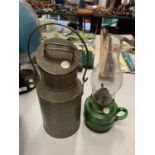 A VINTAGE MILK CAN AND A GREEN GLASS HAND HELD GAS LAMP