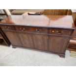 AN INLAID MAHOGANY SIDEBOARD WITH FOUR DOORS AND THREE DRAWERS