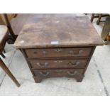 A MINIATURE MAHOGANY CHEST OF THREE DRAWERS