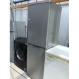 A HOTPOINT FRIDGE FREEZER, LIGHT CLEAN REQUIRED