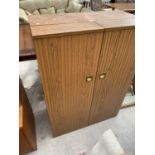 A RETRO TEAK EFFECT OFFICE CABINET WITH TWO FOLD OUT COMPARTMENT DRAWERS, FALL FRONT AND FOUR