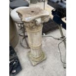 A CONCRETE BIRD BATH STAND