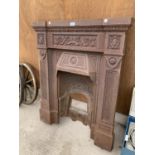 A LARGE ORNATE CAST IRON FIRE PLACE